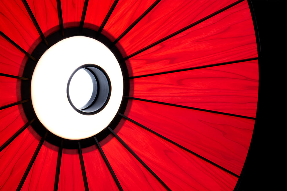 Interior detail of the LZF Banga wooden and LED lamp in red color