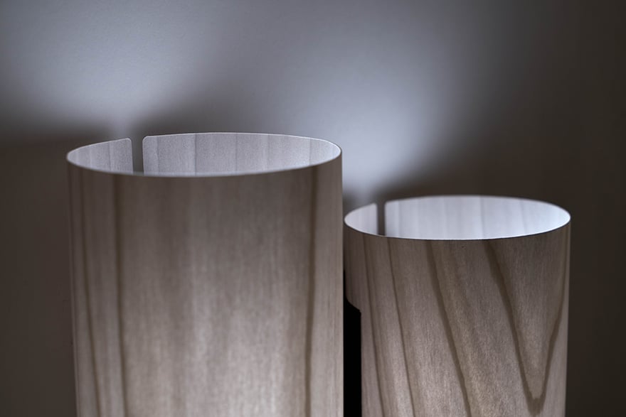 Detail of top view of wall lamp in gray wood