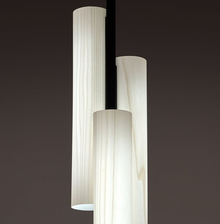Detail of the Black Note floor lamp by LZF in ivory white wood and black metal