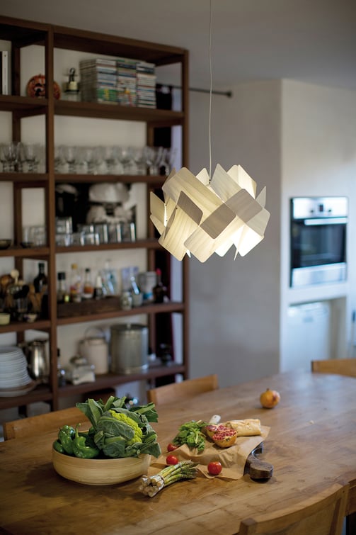 Detail of a kitchen table illuminated with the LZF Escape pendant lamp