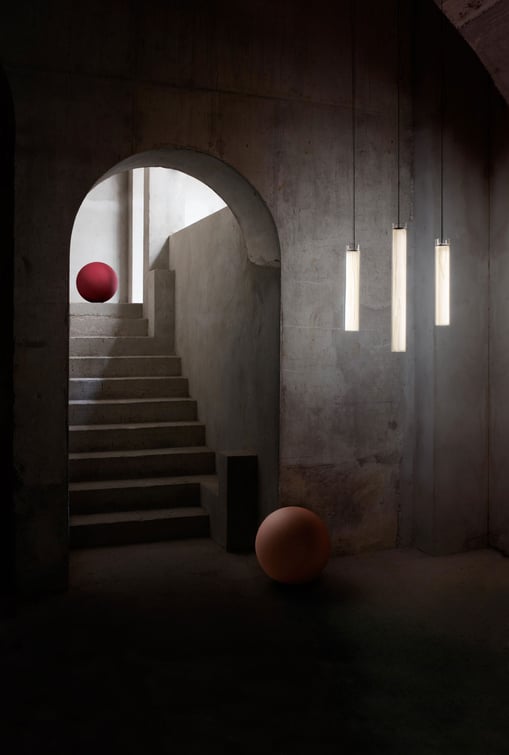 Composition of LZF glass and wood lamps in an architectural space