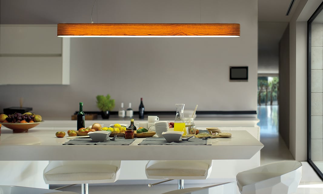 Wooden linear lamp on modern kitchen island