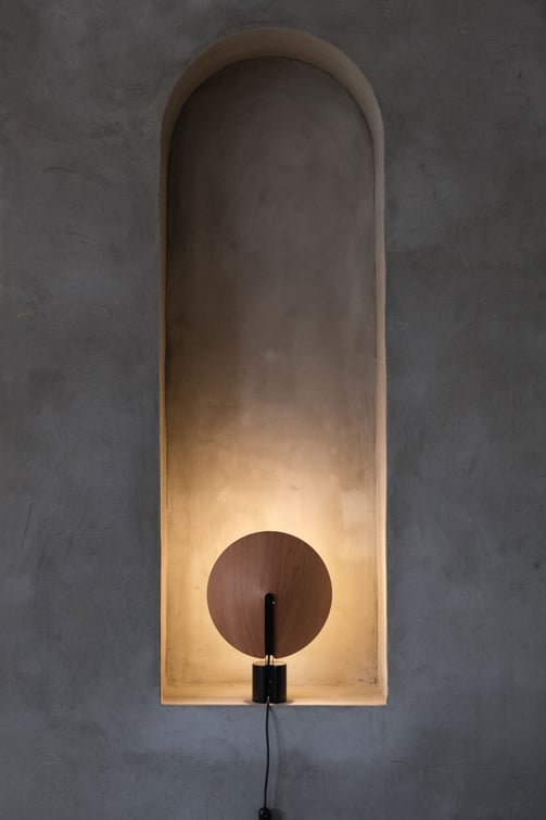 Kasa table lamp has an Ivory White interior wood veneer finish and a Natural Cherry exterior finish