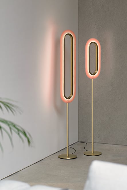 Corner decorated with LZF floor lamps in gilded metal and pink wood