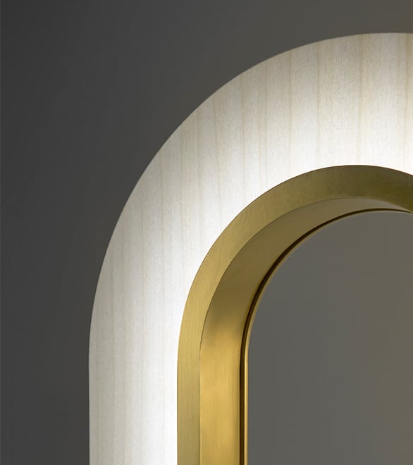 Detail of golden metal and wood veneer lamp