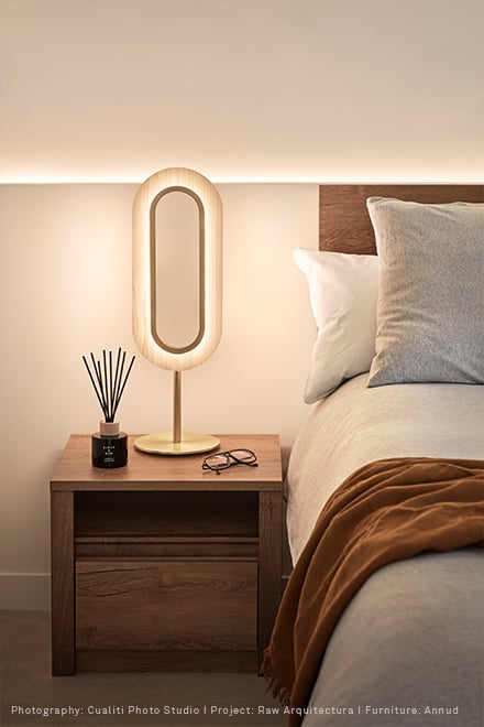 Lens oval table lamp on nightstand in ivory white wood