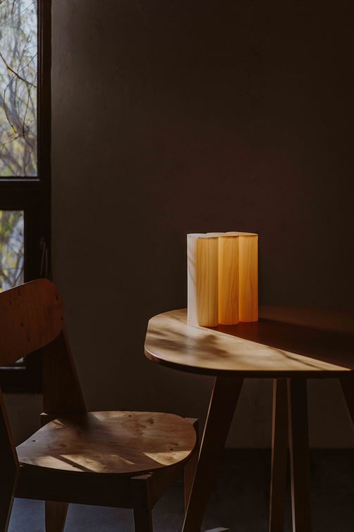 table lamp handmade with natural veneer that evokes the spines of book