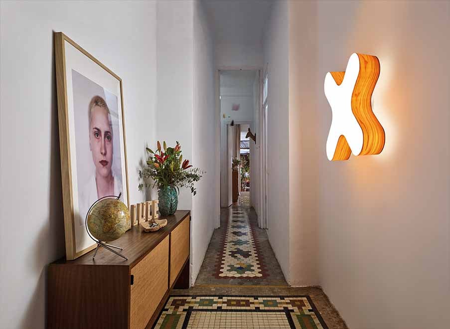 Illuminated corridor with X shaped LZF wall lamp