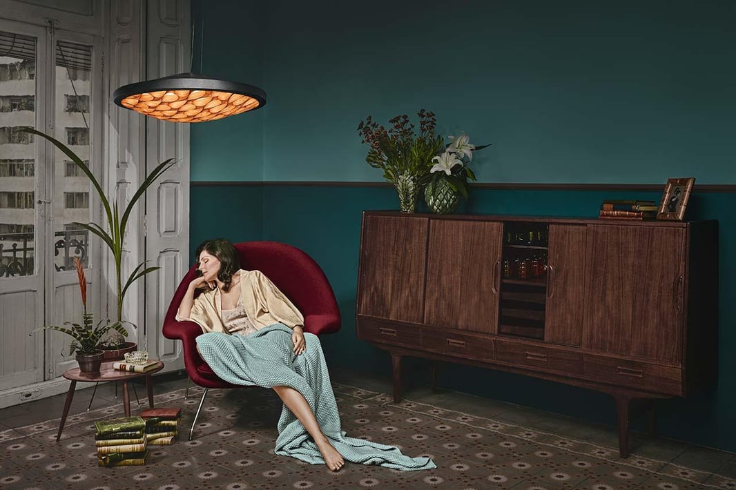 Julie sleeps on Nelson's armchair. LZF Cervantes suspension and wall lamps