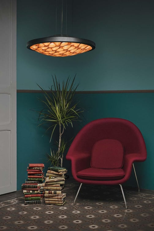 Nelson's armchair is empty. Cervantes suspension lamp
