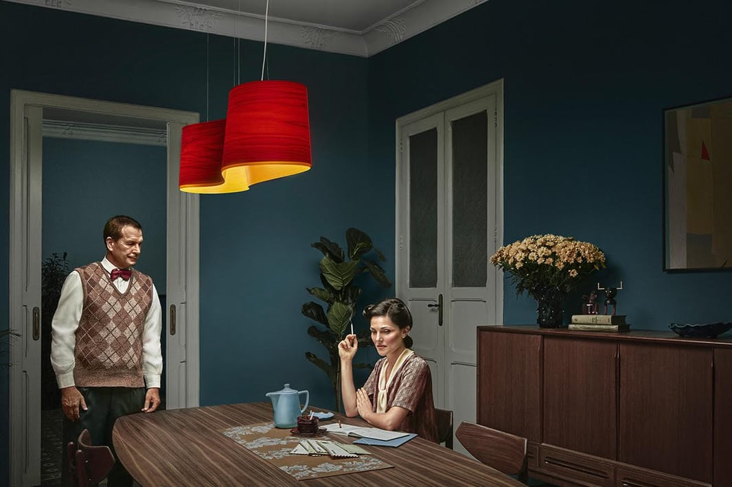 Nelson gets home. Julie is smoking a cigarette. New Wave suspension lamp