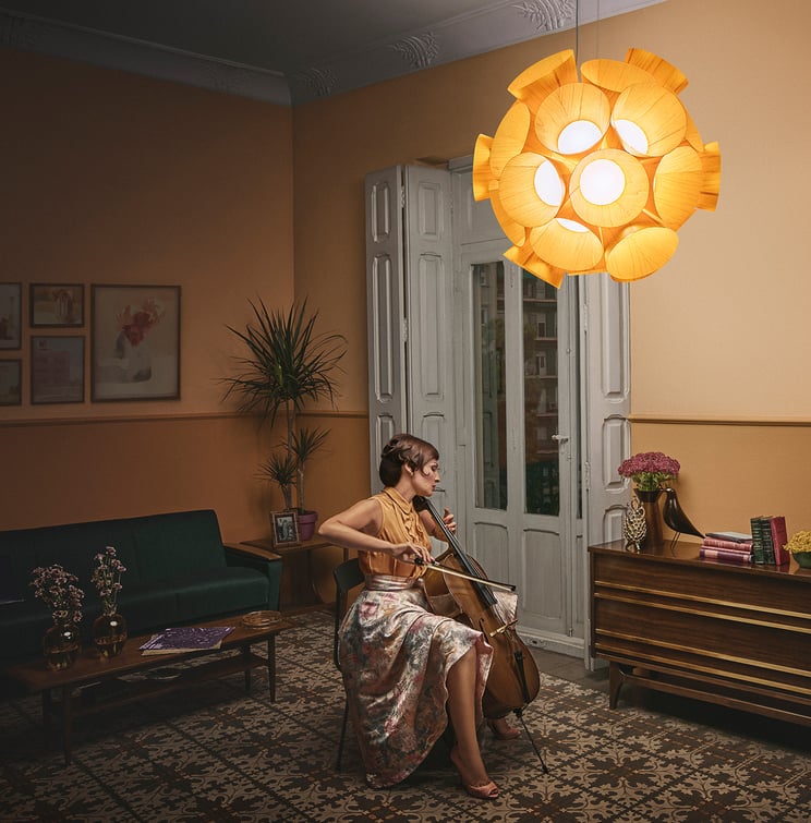 Lana with her cello. Dandelion suspension lamp