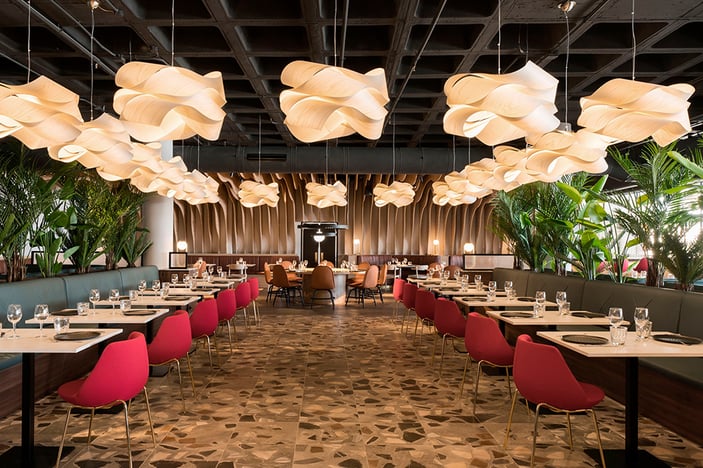 Lighting project-in-a-restaurant-with-a-large-number-of-woven-and-undulating-wood-veneer-lamps