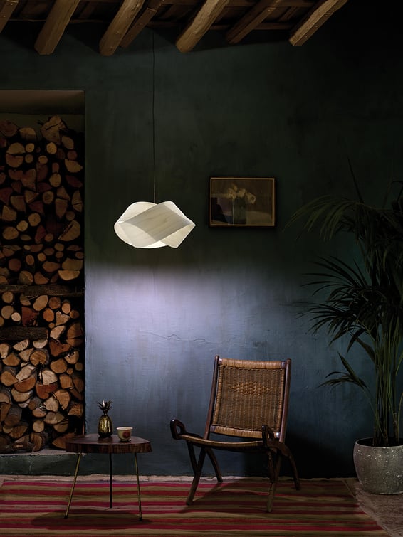 Reading area-with-twisted-wood-veneer-hanging-lamp