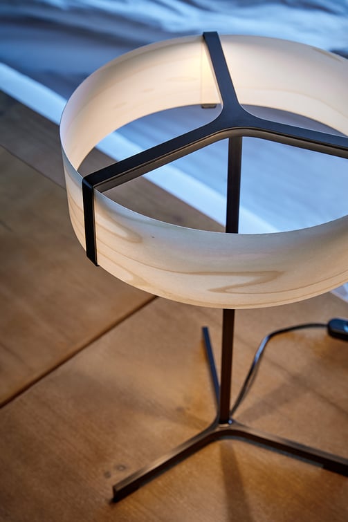 Detail of-table-lamp-with-metal-base-and-diffuser-in-natural-veneer-in-grey-color