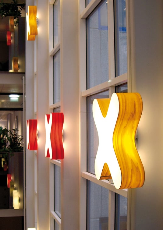 Wall of-office-area-with-X-shaped-wood-veneer-lamps