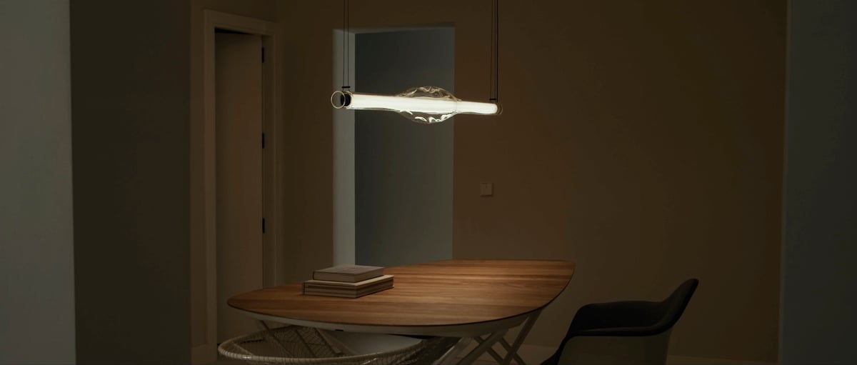 Handcrafted wood-and-glass-lamp-by-LZF-on-a-dining-table