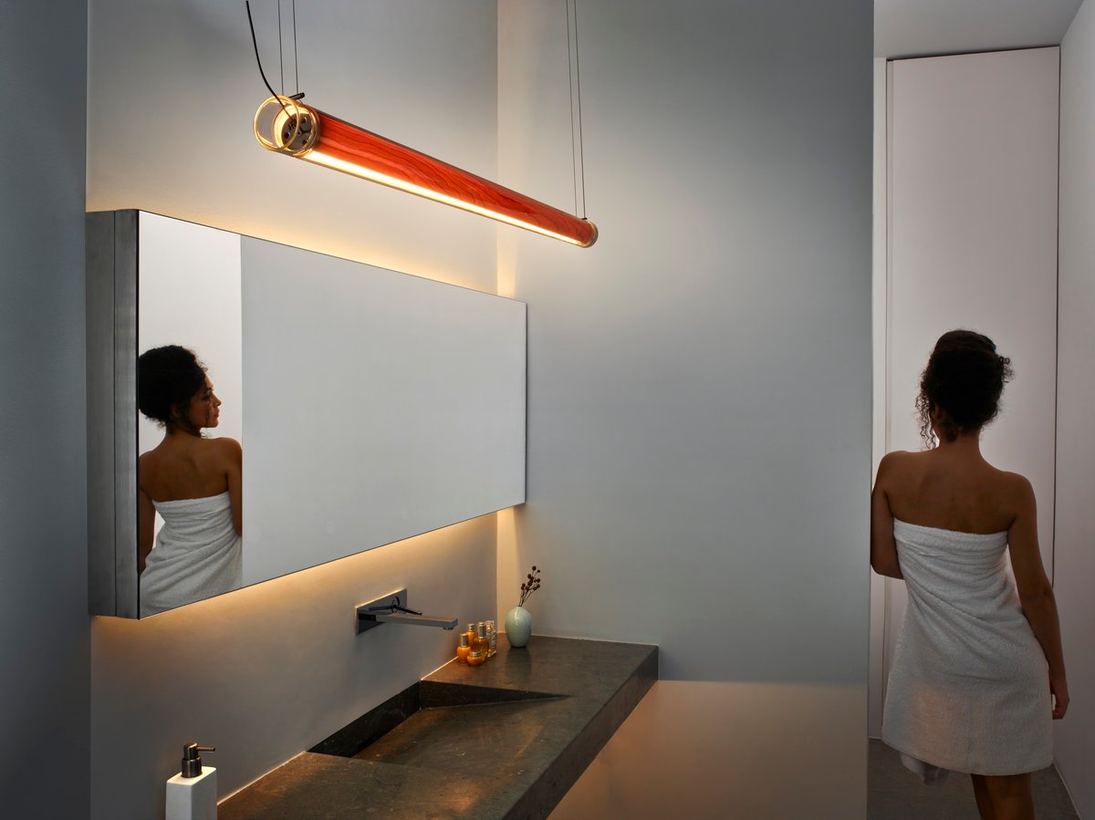 bathroom illuminated-with-a-tubular-crystal-chandelier-that-emanates-light-through-a-thin-natural-wood-veneer