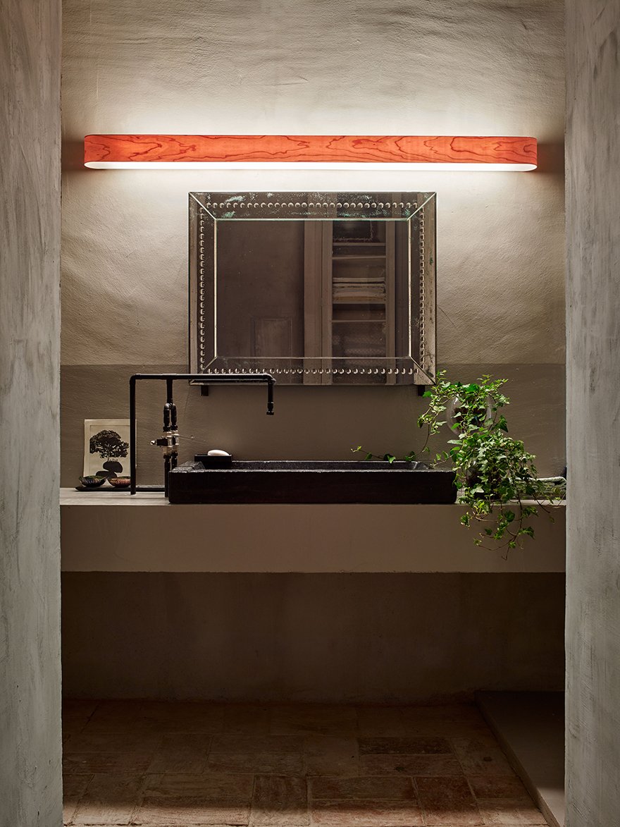 Rustic bathroom-with-long-natural-wood-wall-light-by-LZF