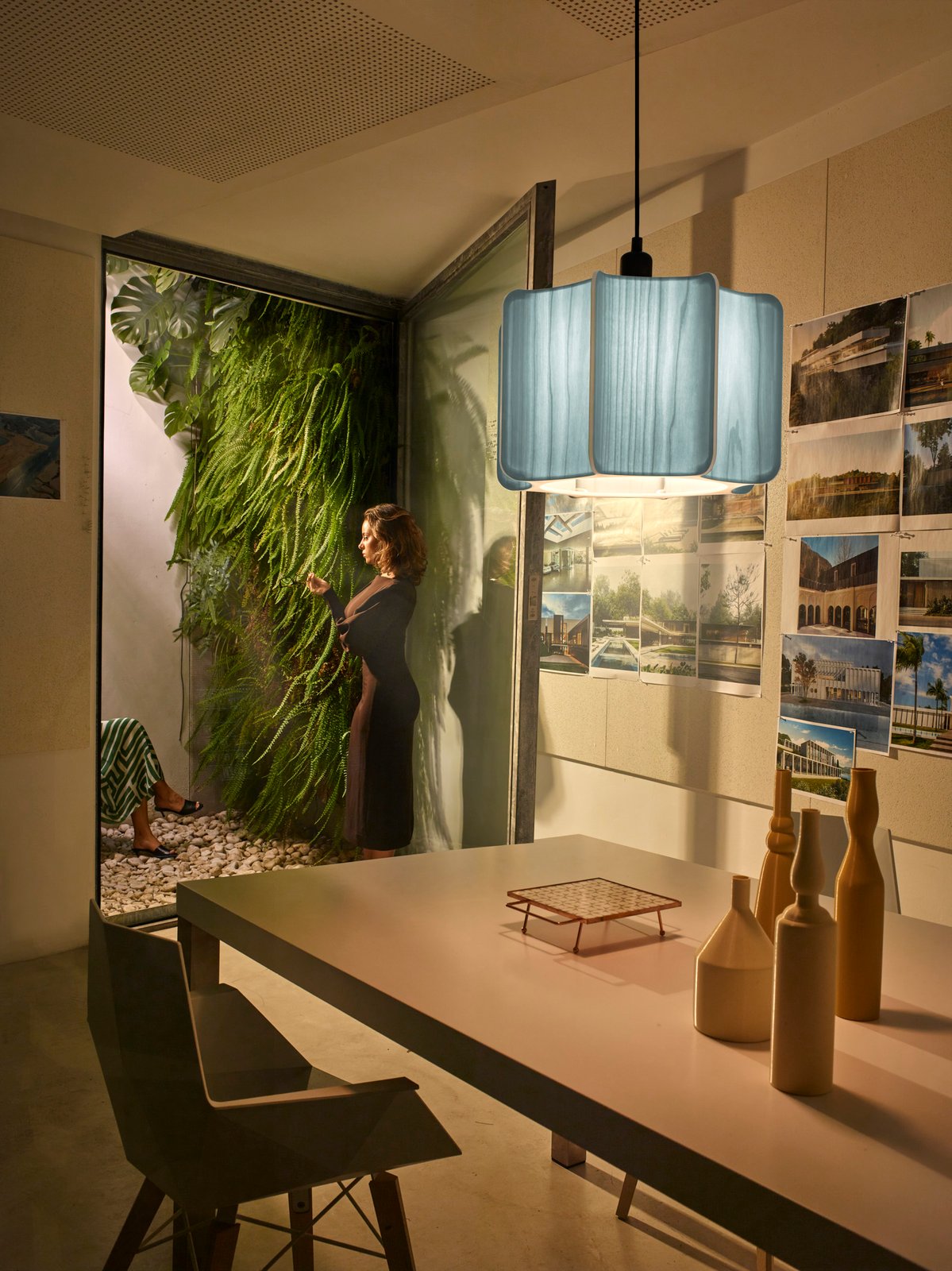 living room-illuminated-with-a-lamp-shade-made-of-wood-veneer-with-a-cactus-silhouette
