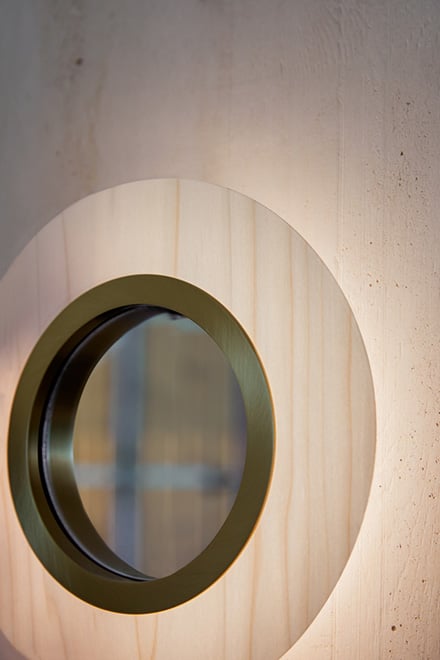 Circular wooden-wall-lamp-with-a-central-mirror