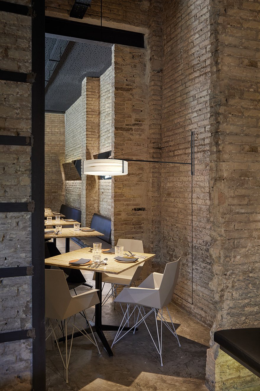 Restaurant table-illuminated-with-wall-lamp-in-elegant-lines-and-natural-veneer