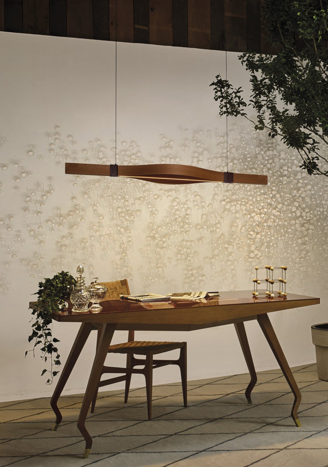 wood veneer-lamp-created-by-Summumstudio-illuminating-a-work-area