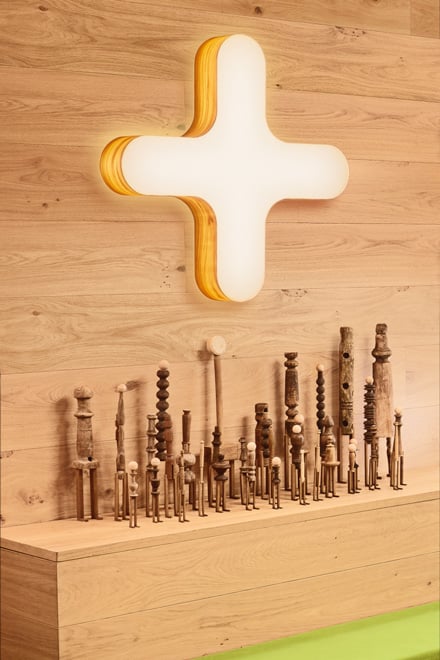 Detail of-the-X-shaped-wall-lamp-of-the-LZF-brand-made-of-wood-veneer